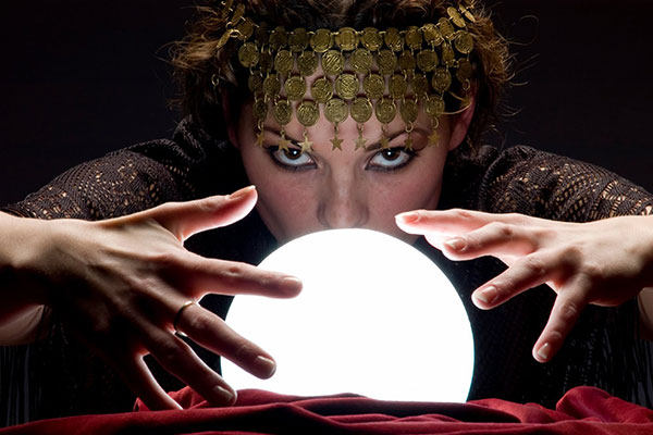 Woman peering into a crystal ball